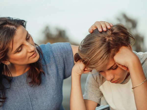 A mother talking with her son about addictive substances.