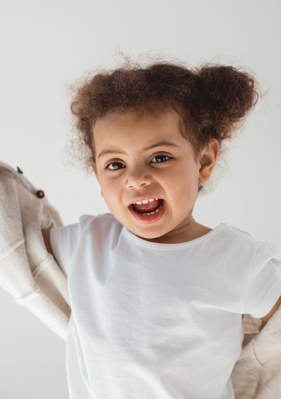 Happy girl toddler playing.