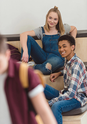 A male and male hanging out at college.