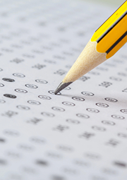 Closeup of pencil filling in circles on a multiple choice test,