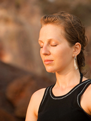 Young Woman Meditating with Eyes Closed