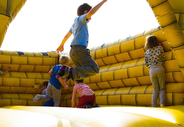 Kids jumping in bouncy castle