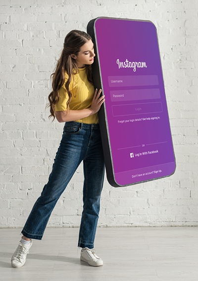 Teen girl holding large phone.