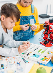 Girl and boy working on STEM project in class.