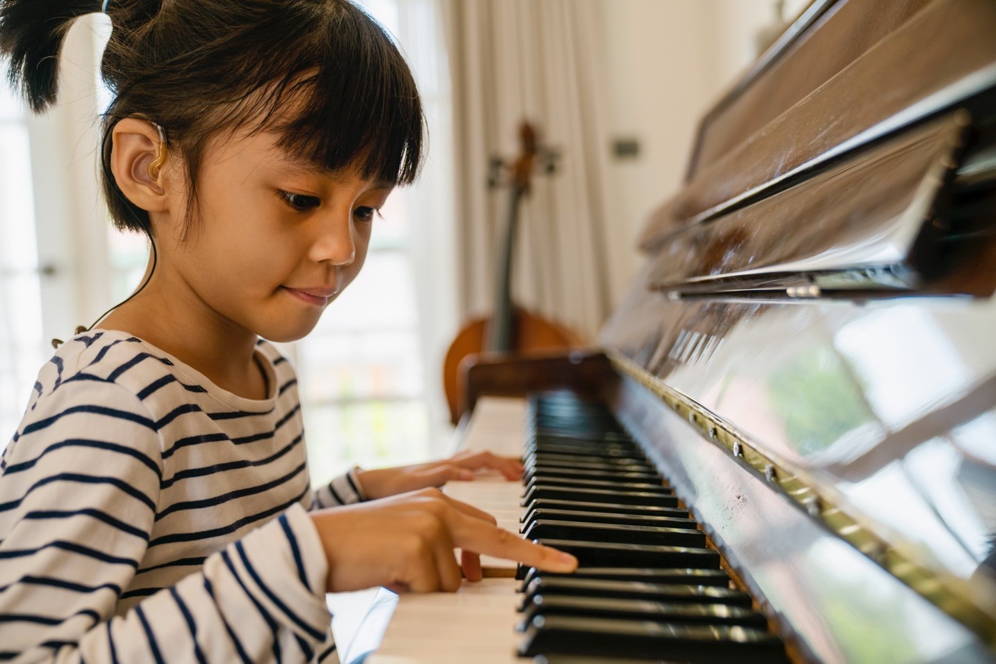 Little girl playing piano.