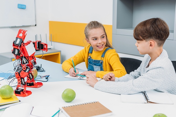 Kids working on robotics projects a STEM Classroom setting.