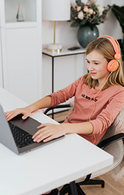 Girl in virtual learning session on laptop.