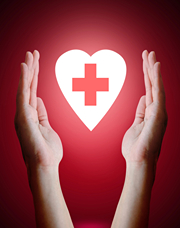 First-Aid cross inside heart as hands enshrine it.