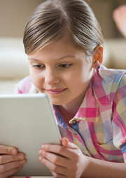 Young Girl Playing on Tablet