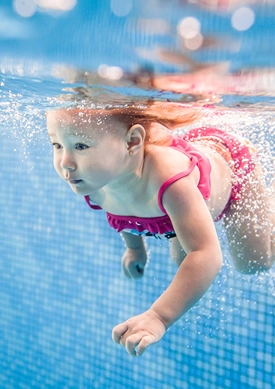 Little girl swimming underwater