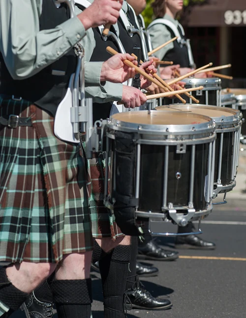 A line of drummers in an Irish parade.