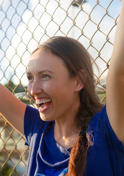 Mom cheering at little league game.