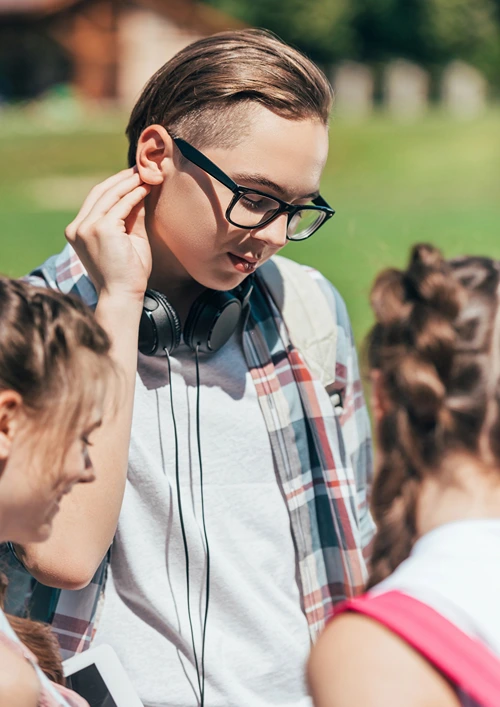 Teens hanging out in a park.