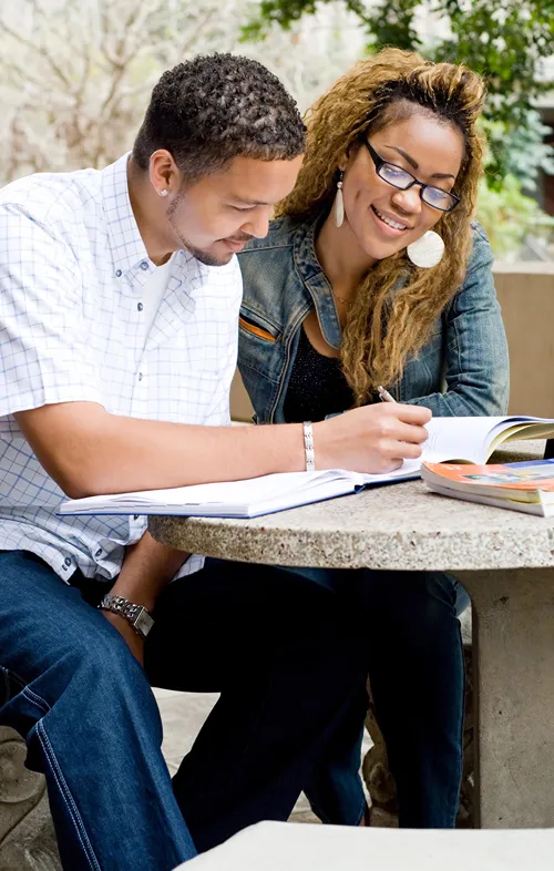 African American male and female students studying together.